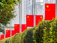 National flags fly along the Golden Buddha Avenue to celebrate the upcoming National Day in Chongqing, China, on September 24, 2024. (