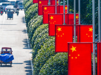 National flags fly along the Golden Buddha Avenue to celebrate the upcoming National Day in Chongqing, China, on September 24, 2024. (