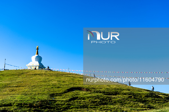 Domestic tourists hike on Sailung Hill in Dolakha, Nepal, on September 23, 2024. 