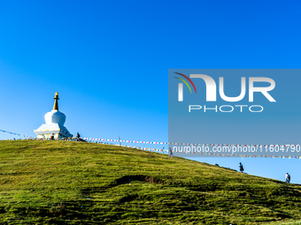 Domestic tourists hike on Sailung Hill in Dolakha, Nepal, on September 23, 2024. (