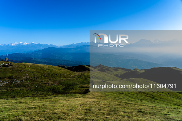 Domestic tourists hike on Sailung Hill in Dolakha, Nepal, on September 23, 2024. 