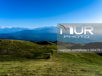 Domestic tourists hike on Sailung Hill in Dolakha, Nepal, on September 23, 2024. (