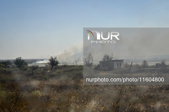 Fires burn along the road from Kurakhove to Hirnyk as a result of Russian artillery shelling in Pokrovsk district, Donetsk region, eastern U...