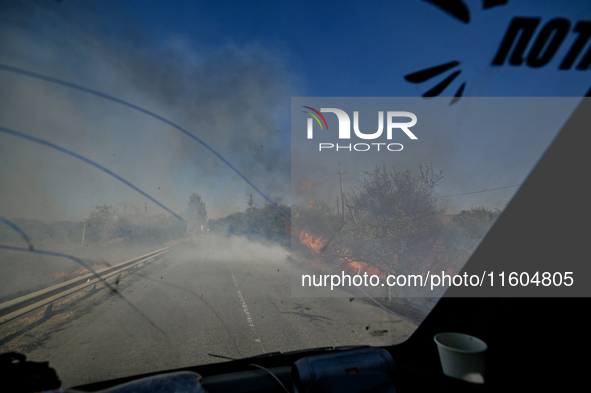 Fires burn along the road from Kurakhove to Hirnyk as a result of Russian artillery shelling in Pokrovsk district, Donetsk region, eastern U...