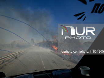 Fires burn along the road from Kurakhove to Hirnyk as a result of Russian artillery shelling in Pokrovsk district, Donetsk region, eastern U...