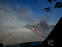 Fires burn along the road from Kurakhove to Hirnyk as a result of Russian artillery shelling in Pokrovsk district, Donetsk region, eastern U...