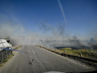 Fires burn along the road from Kurakhove to Hirnyk as a result of Russian artillery shelling in Pokrovsk district, Donetsk region, eastern U...