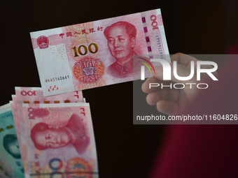 Chinese Yuan banknotes are pictured in Fuyang, China, on September 24, 2024. On September 24, the People's Bank of China announces that it w...