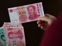 Chinese Yuan banknotes are pictured in Fuyang, China, on September 24, 2024. On September 24, the People's Bank of China announces that it w...