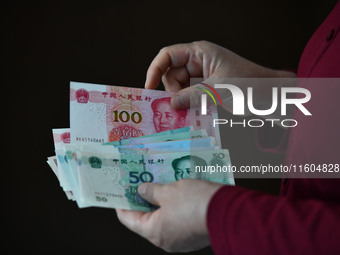 Chinese Yuan banknotes are pictured in Fuyang, China, on September 24, 2024. On September 24, the People's Bank of China announces that it w...