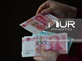 Chinese Yuan banknotes are pictured in Fuyang, China, on September 24, 2024. On September 24, the People's Bank of China announces that it w...