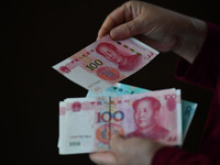 Chinese Yuan banknotes are pictured in Fuyang, China, on September 24, 2024. On September 24, the People's Bank of China announces that it w...