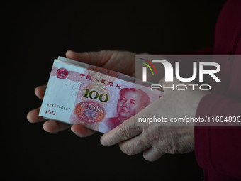 Chinese Yuan banknotes are pictured in Fuyang, China, on September 24, 2024. On September 24, the People's Bank of China announces that it w...