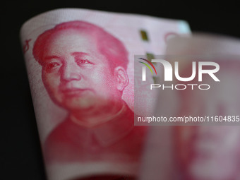 Chinese Yuan banknotes are pictured in Fuyang, China, on September 24, 2024. On September 24, the People's Bank of China announces that it w...