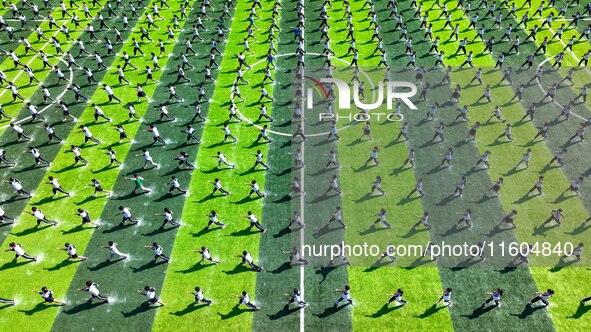 Primary school students practice martial arts during a class break in Tongren, China, on September 24, 2024. 