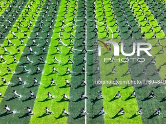 Primary school students practice martial arts during a class break in Tongren, China, on September 24, 2024. (