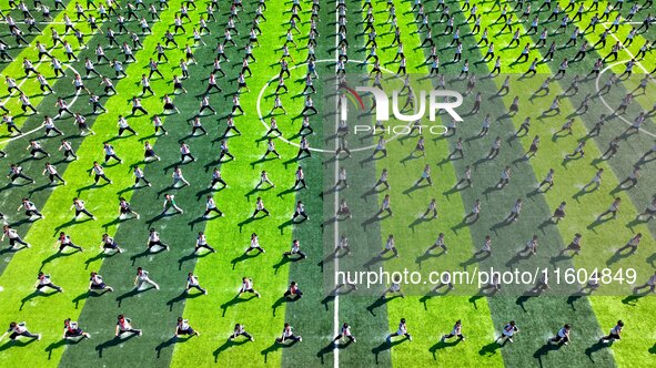 Primary school students practice martial arts during a class break in Tongren, China, on September 24, 2024. 