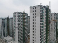 A view from the air shows a newly built commercial housing complex in Hangzhou, China, on September 24, 2024. On the same day, the People's...