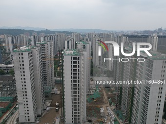 A view from the air shows a newly built commercial housing complex in Hangzhou, China, on September 24, 2024. On the same day, the People's...