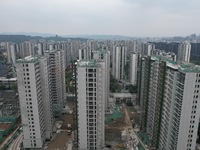 A view from the air shows a newly built commercial housing complex in Hangzhou, China, on September 24, 2024. On the same day, the People's...