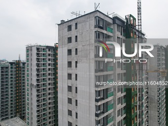 A view from the air shows a newly built commercial housing complex in Hangzhou, China, on September 24, 2024. On the same day, the People's...