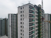 A view from the air shows a newly built commercial housing complex in Hangzhou, China, on September 24, 2024. On the same day, the People's...