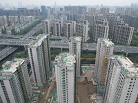 A view from the air shows a newly built commercial housing complex in Hangzhou, China, on September 24, 2024. On the same day, the People's...