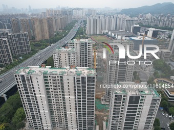 A view from the air shows a newly built commercial housing complex in Hangzhou, China, on September 24, 2024. On the same day, the People's...