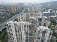 A view from the air shows a newly built commercial housing complex in Hangzhou, China, on September 24, 2024. On the same day, the People's...