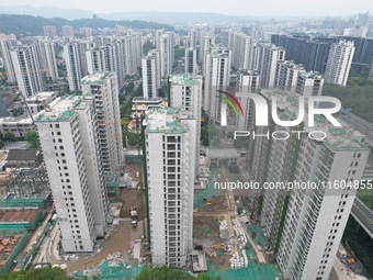 A view from the air shows a newly built commercial housing complex in Hangzhou, China, on September 24, 2024. On the same day, the People's...