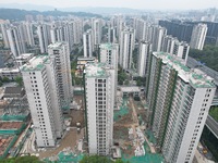 A view from the air shows a newly built commercial housing complex in Hangzhou, China, on September 24, 2024. On the same day, the People's...