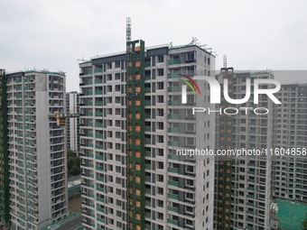 A view from the air shows a newly built commercial housing complex in Hangzhou, China, on September 24, 2024. On the same day, the People's...