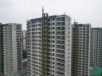 A view from the air shows a newly built commercial housing complex in Hangzhou, China, on September 24, 2024. On the same day, the People's...