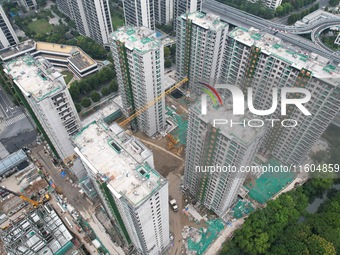 A view from the air shows a newly built commercial housing complex in Hangzhou, China, on September 24, 2024. On the same day, the People's...