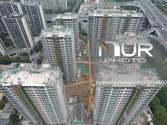 A view from the air shows a newly built commercial housing complex in Hangzhou, China, on September 24, 2024. On the same day, the People's...