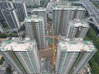 A view from the air shows a newly built commercial housing complex in Hangzhou, China, on September 24, 2024. On the same day, the People's...