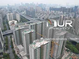 A view from the air shows a newly built commercial housing complex in Hangzhou, China, on September 24, 2024. On the same day, the People's...