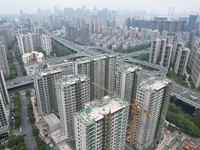 A view from the air shows a newly built commercial housing complex in Hangzhou, China, on September 24, 2024. On the same day, the People's...