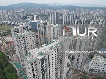 A view from the air shows a newly built commercial housing complex in Hangzhou, China, on September 24, 2024. On the same day, the People's...