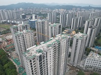 A view from the air shows a newly built commercial housing complex in Hangzhou, China, on September 24, 2024. On the same day, the People's...