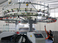 A worker produces products for export at a textile enterprise in Binzhou, China, on September 24, 2024. (