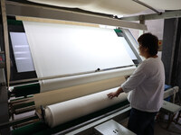 A worker produces products for export at a textile enterprise in Binzhou, China, on September 24, 2024. (