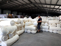 A worker produces products for export at a textile enterprise in Binzhou, China, on September 24, 2024. (