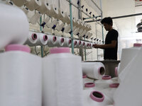 A worker produces products for export at a textile enterprise in Binzhou, China, on September 24, 2024. (