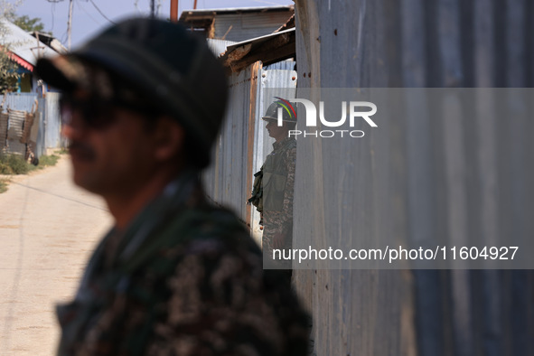 Paramilitary soldiers stand alert during an election campaign in Sopore, Jammu and Kashmir, India, on September 24, 2024 