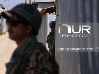 Paramilitary soldiers stand alert during an election campaign in Sopore, Jammu and Kashmir, India, on September 24, 2024 (