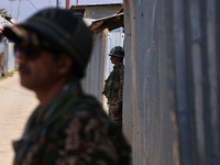 Paramilitary soldiers stand alert during an election campaign in Sopore, Jammu and Kashmir, India, on September 24, 2024 (