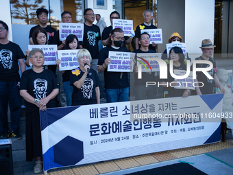 Artists and cultural figures hold a press conference in front of the German Embassy, protesting against the removal of the Peace Statue in B...