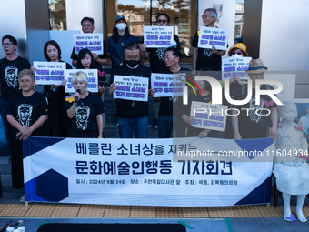 Artists and cultural figures hold a press conference in front of the German Embassy, protesting against the removal of the Peace Statue in B...