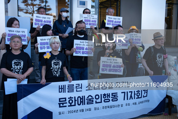 Artists and cultural figures hold a press conference in front of the German Embassy, protesting against the removal of the Peace Statue in B...